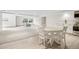 Spacious finished basement with dining area, kitchenette, and cozy sitting area at 7760 Crestview Ln, Niwot, CO 80504
