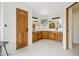Large bathroom features double vanities, knotty wood cabinets, and tile flooring at 7760 Crestview Ln, Niwot, CO 80504
