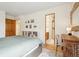 Cozy bedroom with attached bathroom, built in shelving and desk at 7760 Crestview Ln, Niwot, CO 80504
