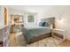 Comfortable bedroom with a well-lit window and a desk against the wall, offering a tranquil retreat at 7760 Crestview Ln, Niwot, CO 80504