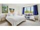 Well-lit bedroom featuring two windows and daybed, with scenic outdoor view at 7760 Crestview Ln, Niwot, CO 80504