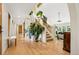 Welcoming foyer with hardwood floors, staircase, and bright, open feel at 7760 Crestview Ln, Niwot, CO 80504