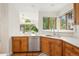 Bright kitchen features ample counter space, modern appliances, tile floors, and a view to the dining area at 7760 Crestview Ln, Niwot, CO 80504