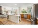 Spacious kitchen features a large island, stainless steel appliances, tile floors, and a modern aesthetic at 7760 Crestview Ln, Niwot, CO 80504
