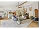 Bright and airy living room seamlessly connecting to the kitchen and staircase at 7760 Crestview Ln, Niwot, CO 80504