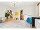 Cozy living room with hardwood floors, archways, stairs, and bright natural light at 7760 Crestview Ln, Niwot, CO 80504