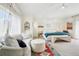 Serene main bedroom featuring a sitting area, bench, lots of natural light, and tasteful decorations at 7760 Crestview Ln, Niwot, CO 80504
