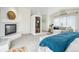 Bright primary bedroom with fireplace, dry sauna and seating area at 7760 Crestview Ln, Niwot, CO 80504