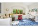 Bright office with a red faux fireplace, large windows, and white desk at 7760 Crestview Ln, Niwot, CO 80504