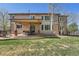 Large backyard with a covered patio and dining set at 18971 E Pinewood Dr, Aurora, CO 80016