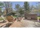 Relaxing backyard patio area with hot tub, cozy seating, and a fire pit perfect for outdoor entertaining at 18971 E Pinewood Dr, Aurora, CO 80016