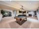 Finished basement with a pool table, wet bar, and home gym at 18971 E Pinewood Dr, Aurora, CO 80016