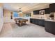 Finished basement with a pool table, wet bar and neutral carpeting at 18971 E Pinewood Dr, Aurora, CO 80016