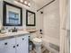 Updated bathroom with new subway tile, modern vanity, and black hardware at 18971 E Pinewood Dr, Aurora, CO 80016