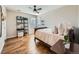 Bedroom featuring hardwood floors, a ceiling fan, and natural light at 18971 E Pinewood Dr, Aurora, CO 80016