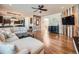 Open-concept living area with hardwood floors, custom woodwork, and lots of room for entertaining at 18971 E Pinewood Dr, Aurora, CO 80016