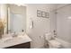 Clean bathroom with a bathtub, toilet and vanity at 7880 Horsebrush Ln # A, Littleton, CO 80125