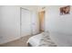 Well-lit bedroom with closet and neutral color palette at 7880 Horsebrush Ln # A, Littleton, CO 80125