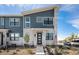 Modern two-story home with gray and beige siding at 7880 Horsebrush Ln # A, Littleton, CO 80125