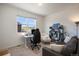 Bright home office features built-in shelving, desk, and comfortable seating at 7880 Horsebrush Ln # A, Littleton, CO 80125