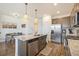 Modern kitchen with stainless steel appliances and granite countertops at 7880 Horsebrush Ln # A, Littleton, CO 80125