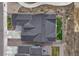 Aerial view of a home featuring a complex roof design and manicured landscaping at 4797 Saddle Iron Rd, Castle Rock, CO 80104
