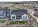 Inviting home with covered patio, fenced yard, and outdoor seating area, perfect for entertaining guests at 4797 Saddle Iron Rd, Castle Rock, CO 80104