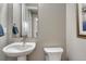 Powder room with pedestal sink, neutral paint, and framed art at 4797 Saddle Iron Rd, Castle Rock, CO 80104