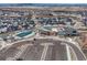 Community clubhouse with a pool, parking, and well-maintained landscaping at 4797 Saddle Iron Rd, Castle Rock, CO 80104