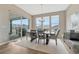 Bright dining room with large windows and stylish decor with easy access to the back porch at 4797 Saddle Iron Rd, Castle Rock, CO 80104