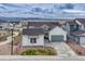Charming home with gray roof, neutral exterior, two-car garage, and well-kept front yard at 4797 Saddle Iron Rd, Castle Rock, CO 80104