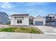 Charming one-story home featuring a well-kept lawn, modern design, and a two-car garage at 4797 Saddle Iron Rd, Castle Rock, CO 80104