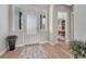 Bright foyer with hardwood floors and views into the office at 4797 Saddle Iron Rd, Castle Rock, CO 80104