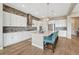 Well-lit modern kitchen featuring stainless steel appliances and a large center island with seating at 4797 Saddle Iron Rd, Castle Rock, CO 80104