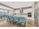 Bright kitchen featuring a large center island with seating and stainless steel appliances at 4797 Saddle Iron Rd, Castle Rock, CO 80104