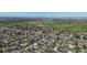 Aerial view of a residential area with homes, trees, and roads, offering a glimpse of the neighborhood and surrounding area at 590 S Troy St, Aurora, CO 80012