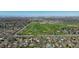 Wide aerial view of a neighborhood with a golf course in the distance, showcasing the community's location at 590 S Troy St, Aurora, CO 80012