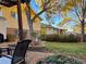Inviting backyard with patio, mature trees providing shade, and a well-maintained lawn perfect for outdoor enjoyment at 590 S Troy St, Aurora, CO 80012