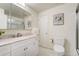 Bright bathroom featuring a glass shower and white marble vanity at 590 S Troy St, Aurora, CO 80012