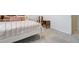 Bright bedroom featuring a full bed, carpet flooring, and bright window at 590 S Troy St, Aurora, CO 80012