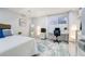 Finished basement with bedroom area, desk, and carpet flooring at 590 S Troy St, Aurora, CO 80012