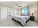 Large main bedroom with two windows, a ceiling fan, and lots of closet space at 590 S Troy St, Aurora, CO 80012