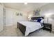 Comfortable bedroom featuring a full bed, carpet flooring, and bright window at 590 S Troy St, Aurora, CO 80012
