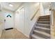 Inviting home foyer features tile floors, two coat closets and stairs to the upper level at 590 S Troy St, Aurora, CO 80012