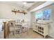 Kitchen eat-in area with table, rolling island and view of downstairs living area at 590 S Troy St, Aurora, CO 80012