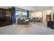 Spacious living room with plush carpet, a large sectional, and a view to the outside at 590 S Troy St, Aurora, CO 80012