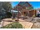 Relaxing pergola with a shaded lounge area, perfect for enjoying the beautiful backyard at 590 S Troy St, Aurora, CO 80012