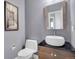 A modern powder room showcases a stylish vanity with vessel sink and contemporary finishes at 20567 E Weaver Dr, Aurora, CO 80016