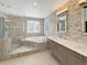 Modern bathroom featuring a tiled walk-in shower, soaking tub, double vanity, and stylish fixtures at 20567 E Weaver Dr, Aurora, CO 80016