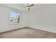 Clean bedroom with natural lighting, neutral colored walls, and ceiling fan at 20567 E Weaver Dr, Aurora, CO 80016